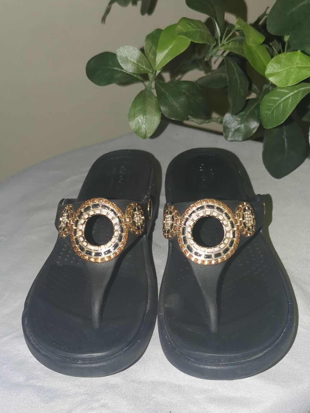 Crocs "Sanrah" Black Thong Sandals with Gold Ring Accent